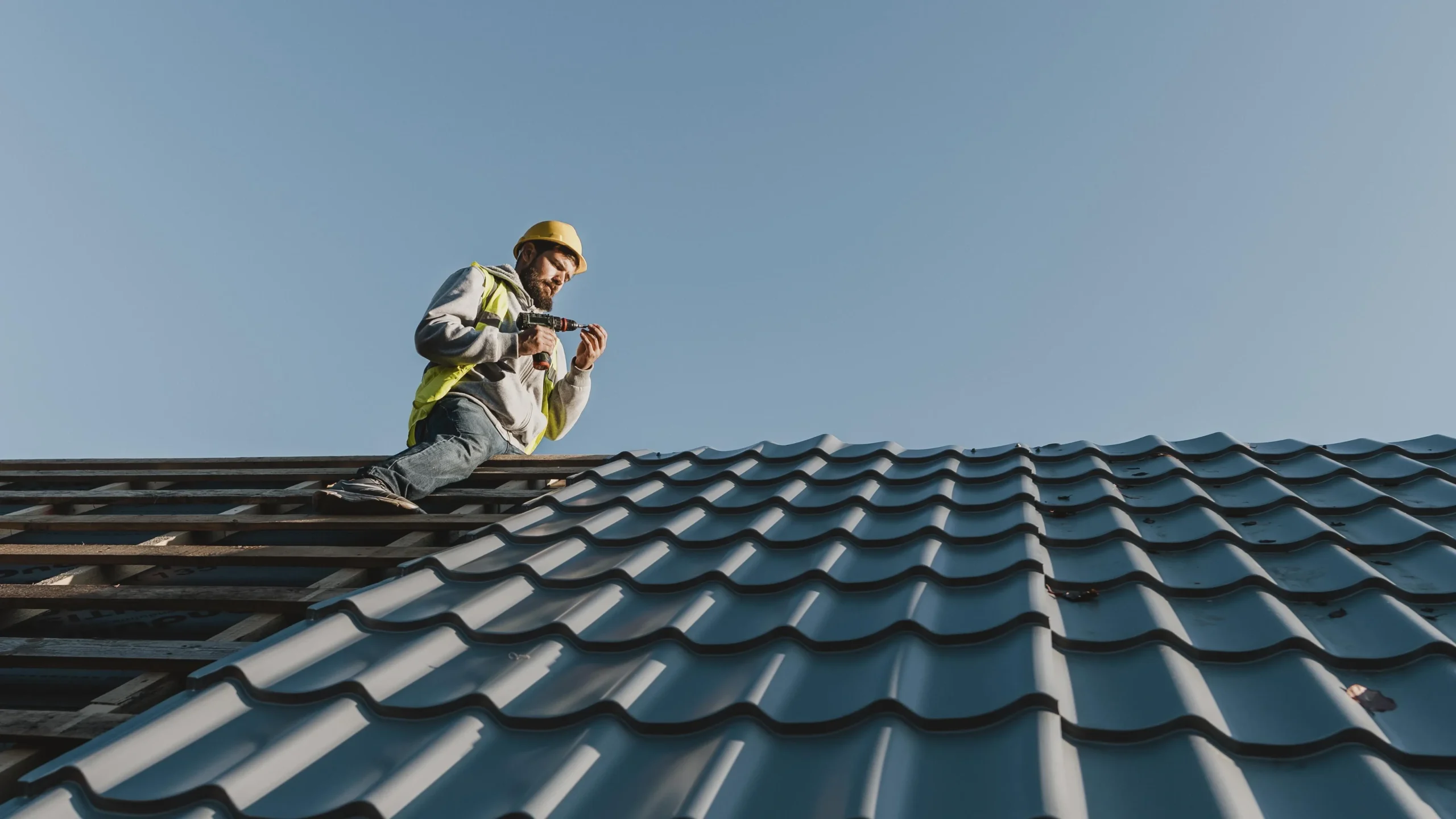 Roofing contractor inspecting a roof with a homeowner